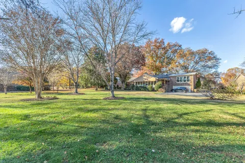 a view of a house with a big yard