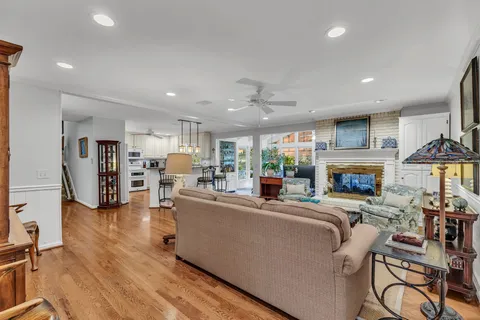 a living room with furniture fireplace and a view of kitchen