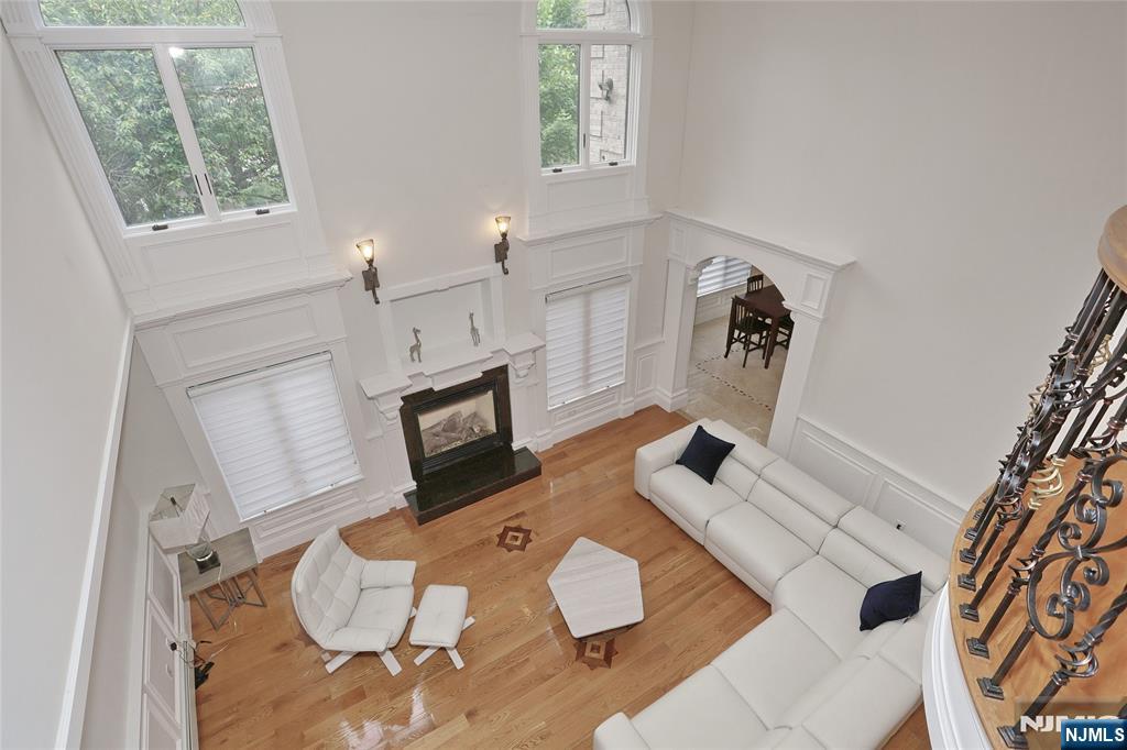 65 Ross Avenue Demarest, NJ 07627 - Photo 15 of 48 a living room with furniture and a fireplace