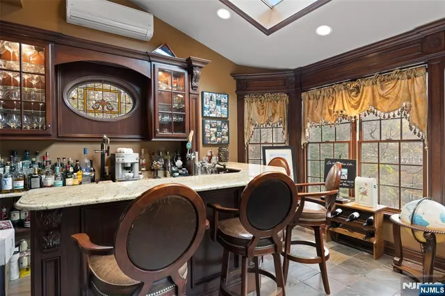 a dining room with a large window and a table