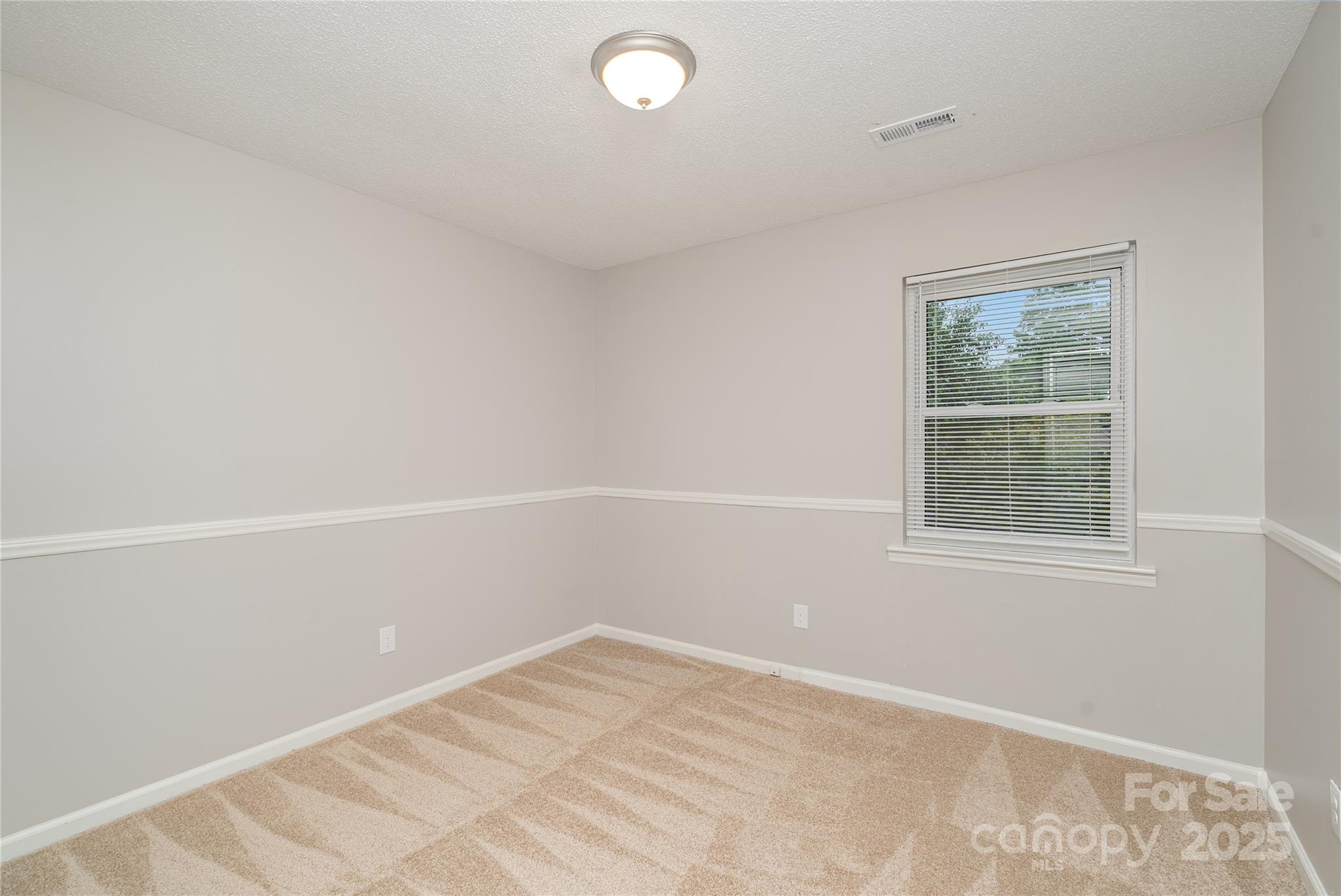 1041 Crowders Creek Road Gastonia, NC 28052 - Photo 11 of 18 an empty room with a window