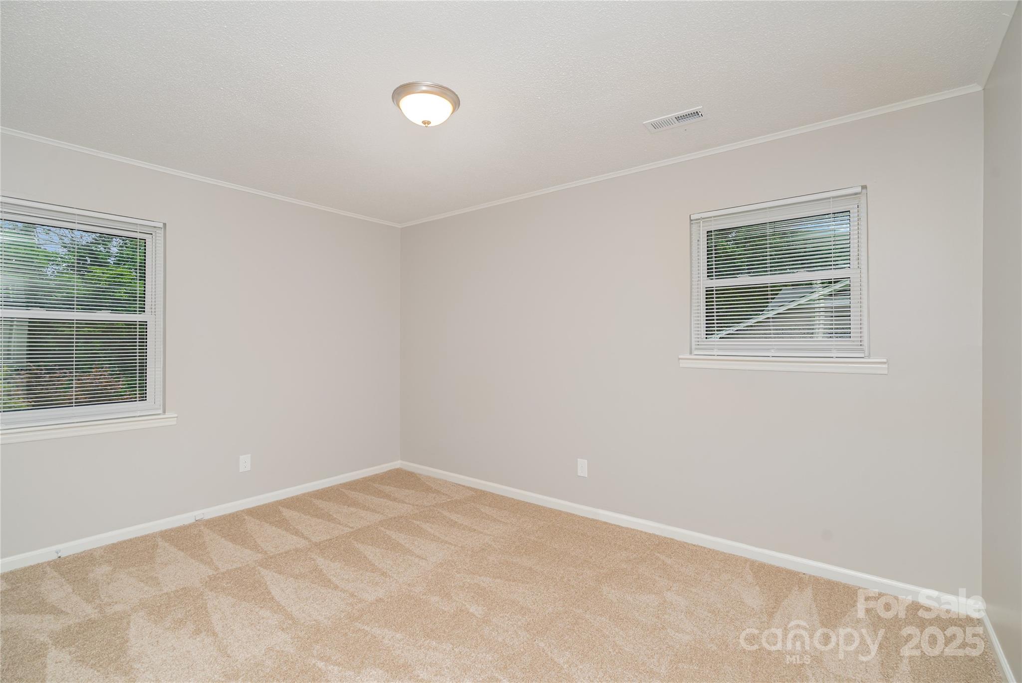 1041 Crowders Creek Road Gastonia, NC 28052 - Photo 12 of 18 an empty room with a window