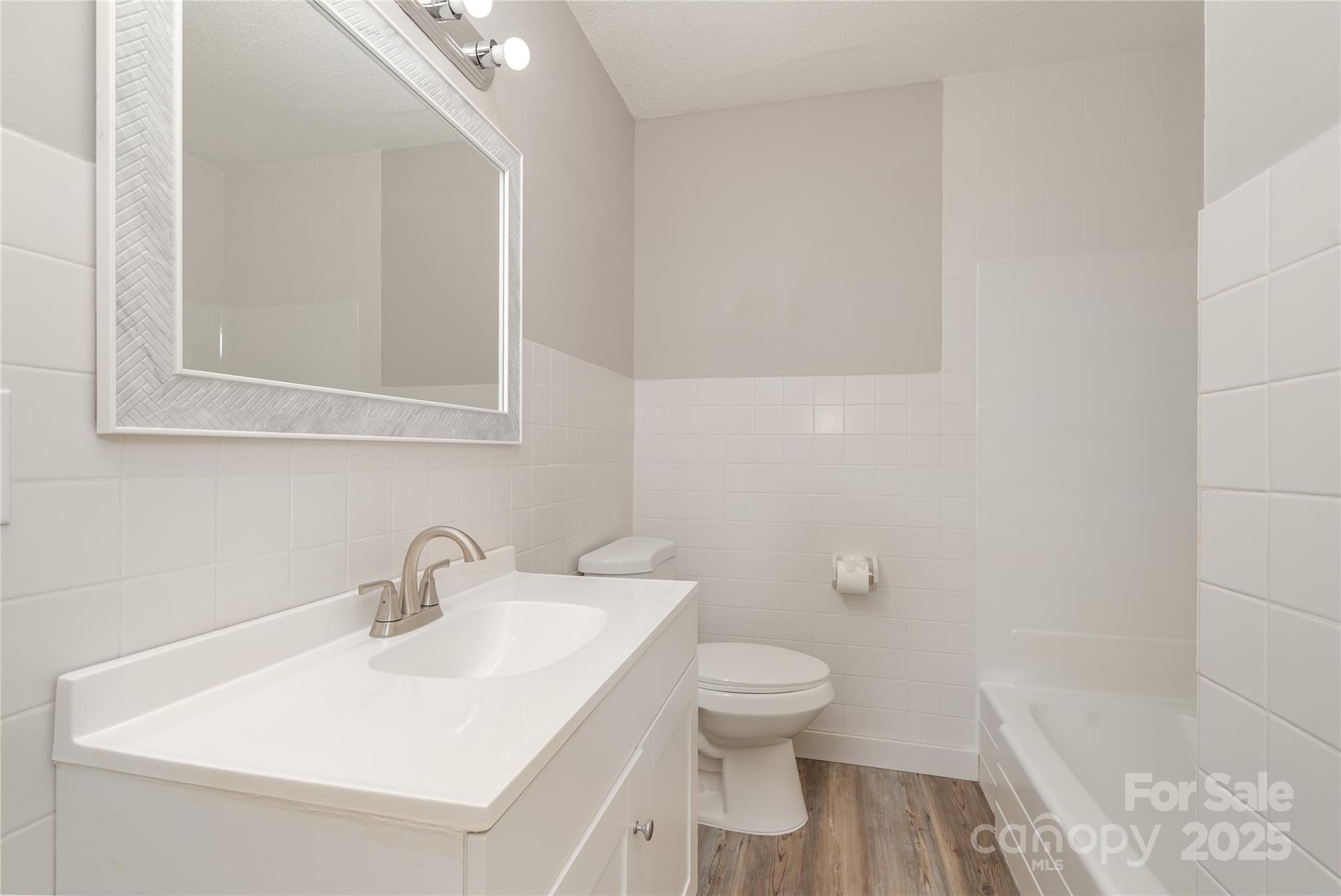 1041 Crowders Creek Road Gastonia, NC 28052 - Photo 13 of 18 a white toilet sitting next to a bathroom sink