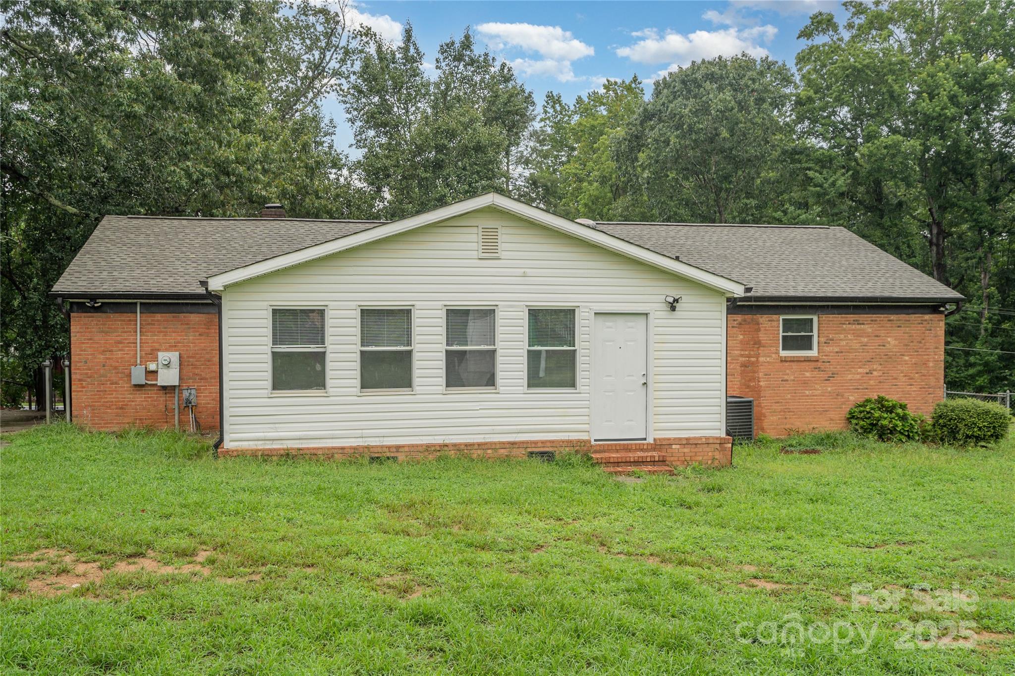 1041 Crowders Creek Road Gastonia, NC 28052 - Photo 15 of 18 a house that is sitting in the grass