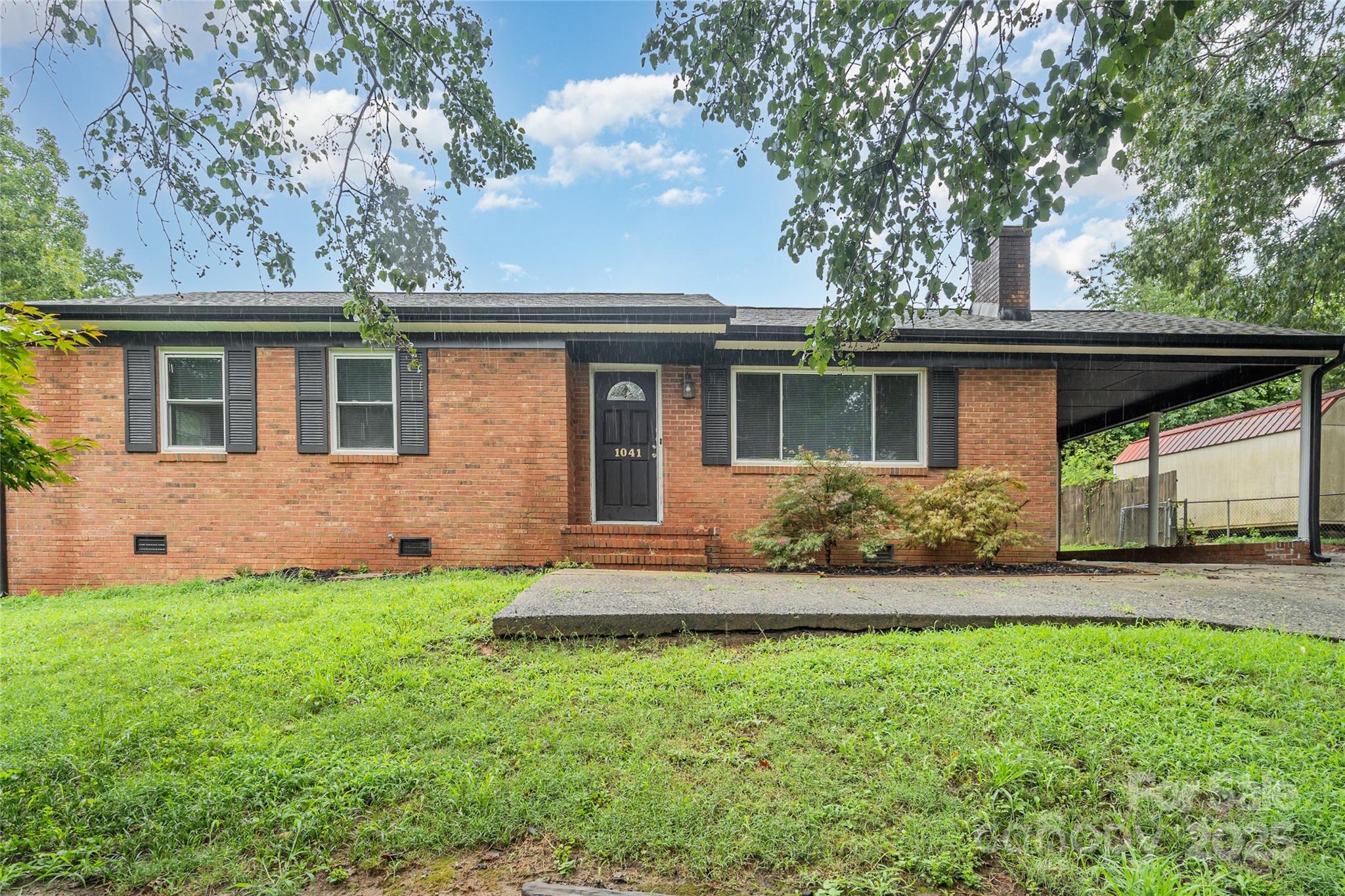 1041 Crowders Creek Road Gastonia, NC 28052 - Photo 17 of 18 front view of a house with a yard