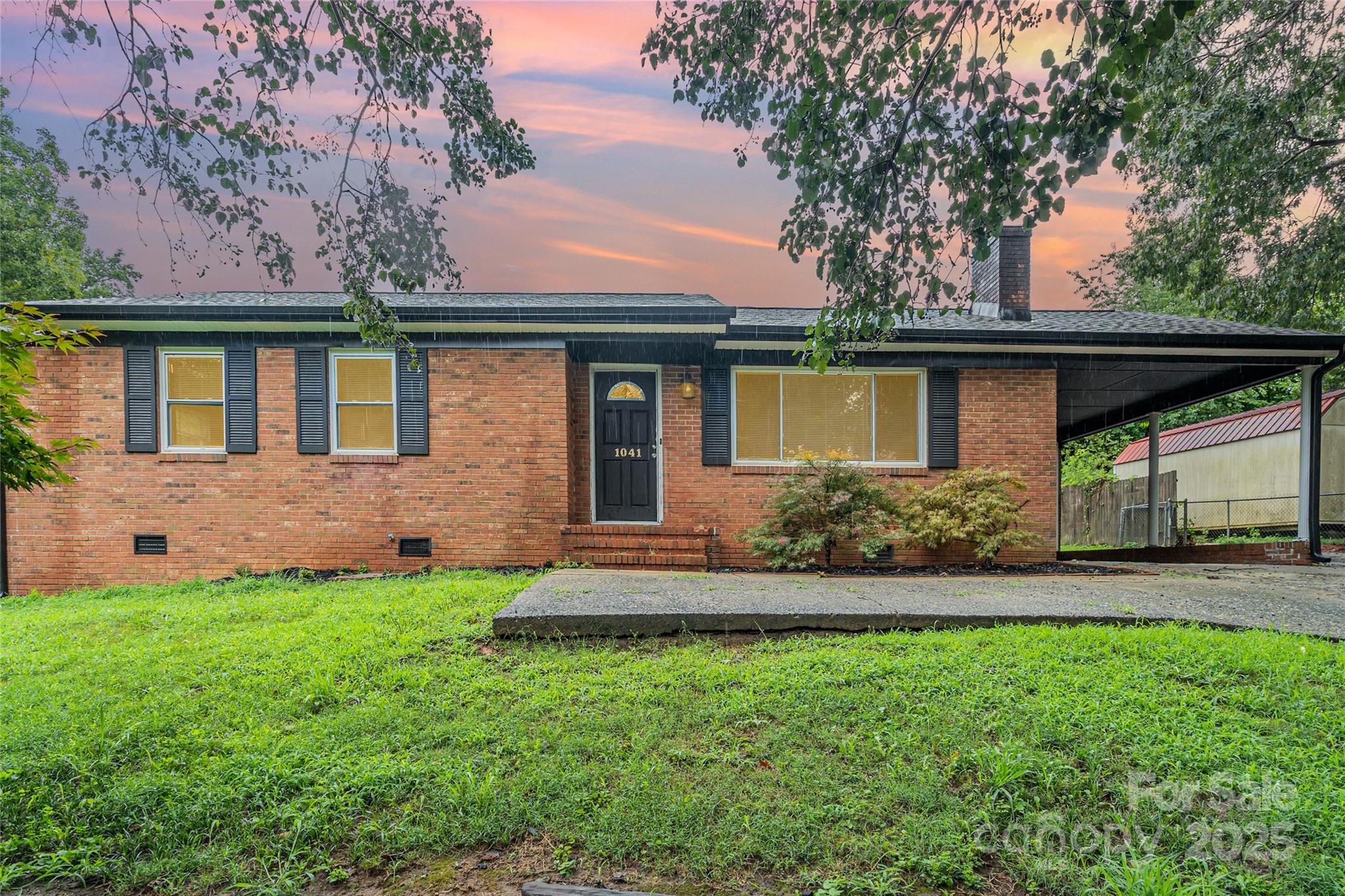 1041 Crowders Creek Road Gastonia, NC 28052 - Photo 18 of 18 a front view of a house with a yard
