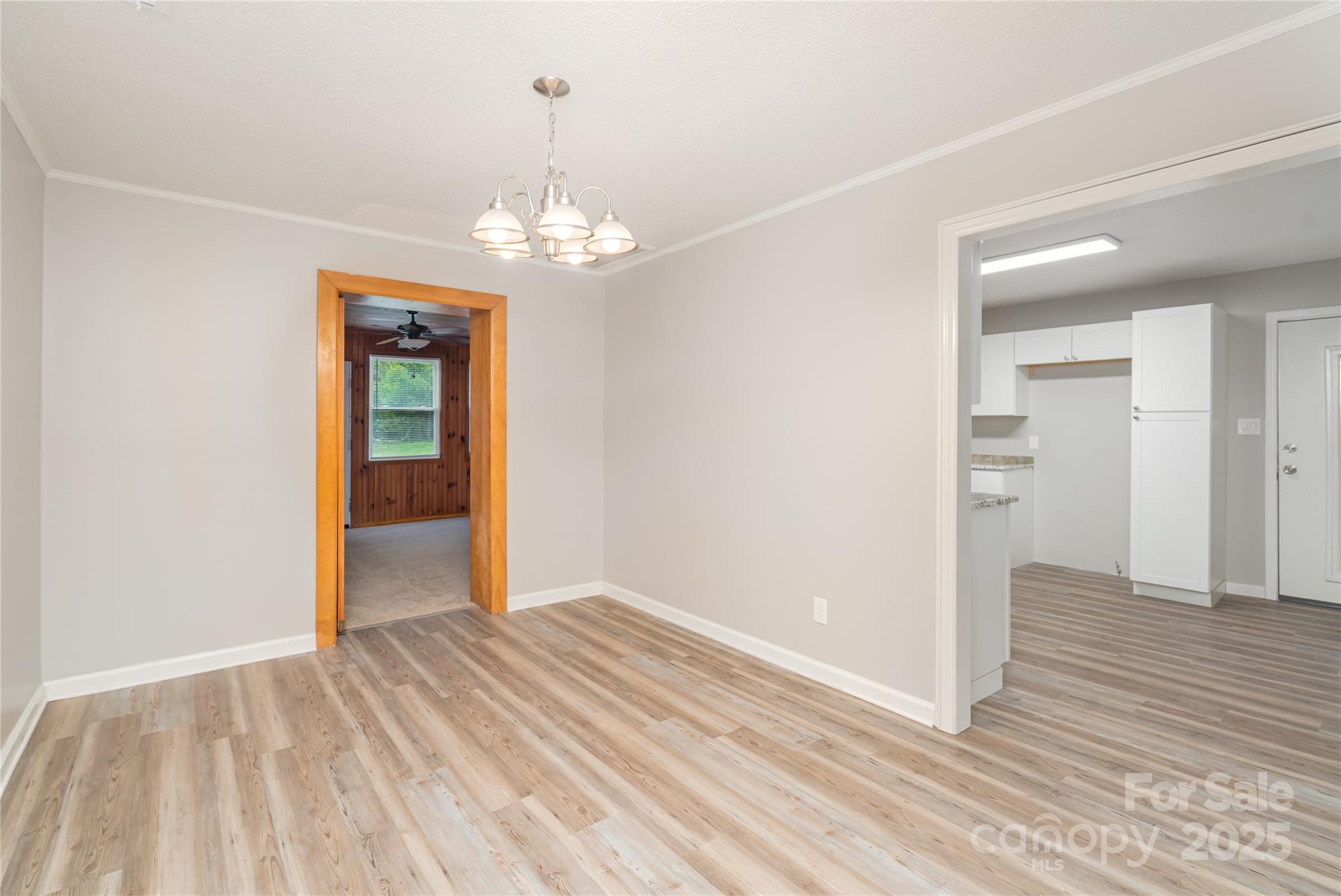 1041 Crowders Creek Road Gastonia, NC 28052 - Photo 9 of 18 a view of livingroom with hardwood floor and hallway