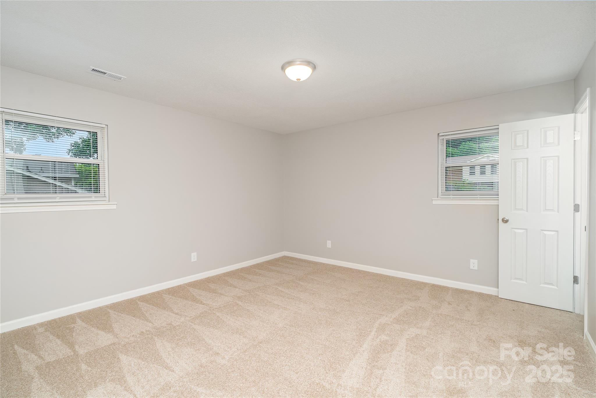 1041 Crowders Creek Road Gastonia, NC 28052 - Photo 10 of 18 an empty room with windows