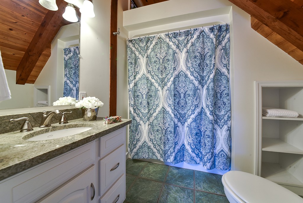 65 Oakhurst Road Hopkinton, MA 01748 - Photo 17 of 27 a bathroom with a granite countertop sink and a mirror