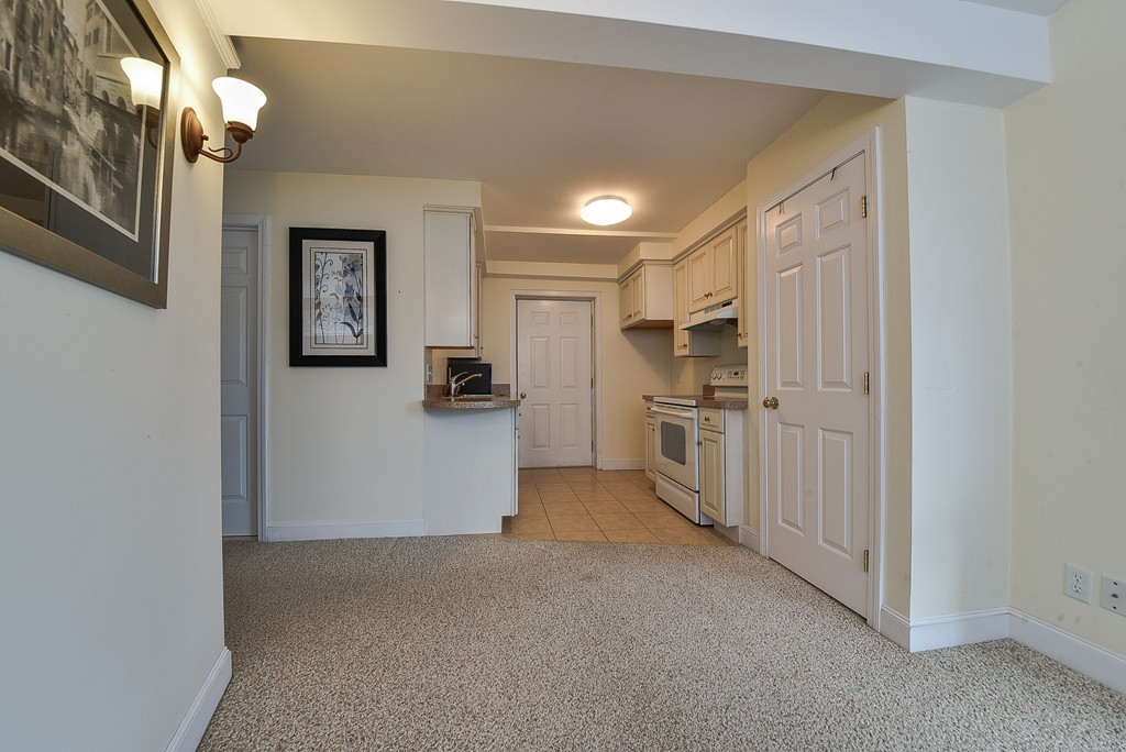 65 Oakhurst Road Hopkinton, MA 01748 - Photo 20 of 27 a view of a kitchen with refrigerator and windows