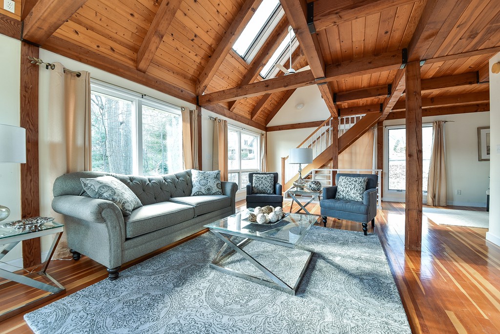 65 Oakhurst Road Hopkinton, MA 01748 - Photo 2 of 27 a living room with furniture a rug and a table