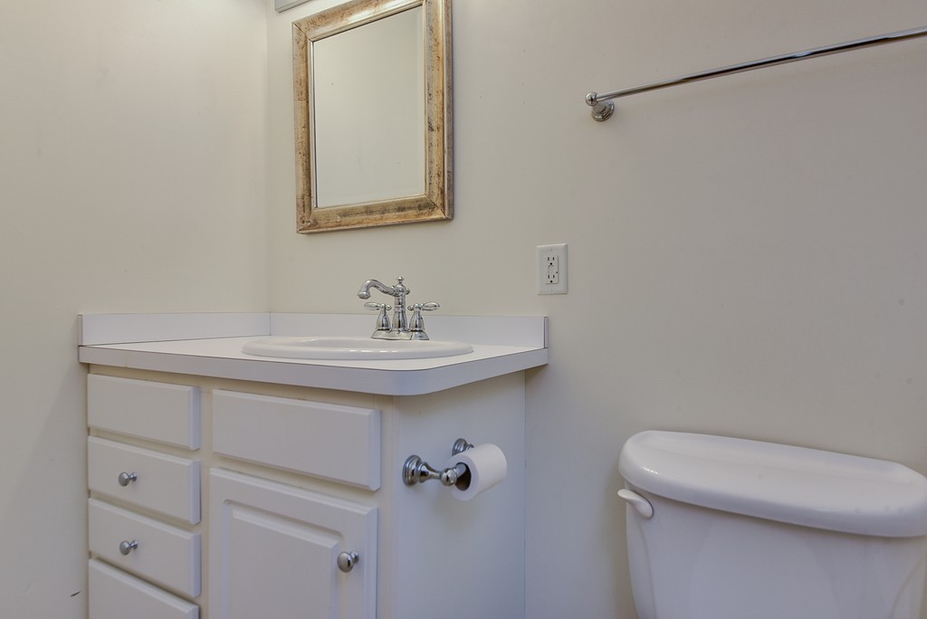 65 Oakhurst Road Hopkinton, MA 01748 - Photo 24 of 27 a bathroom with a sink a toilet and mirror