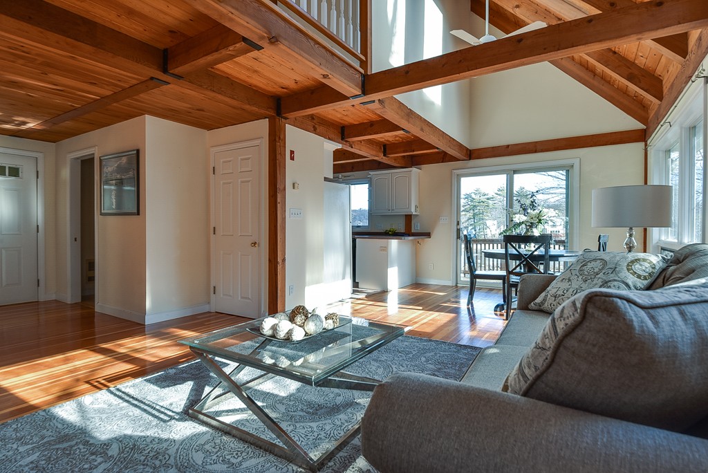 65 Oakhurst Road Hopkinton, MA 01748 - Photo 4 of 27 a living room with patio furniture and a chandelier