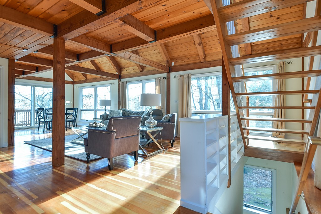 65 Oakhurst Road Hopkinton, MA 01748 - Photo 6 of 27 a living room with furniture a wooden floor and next to a window