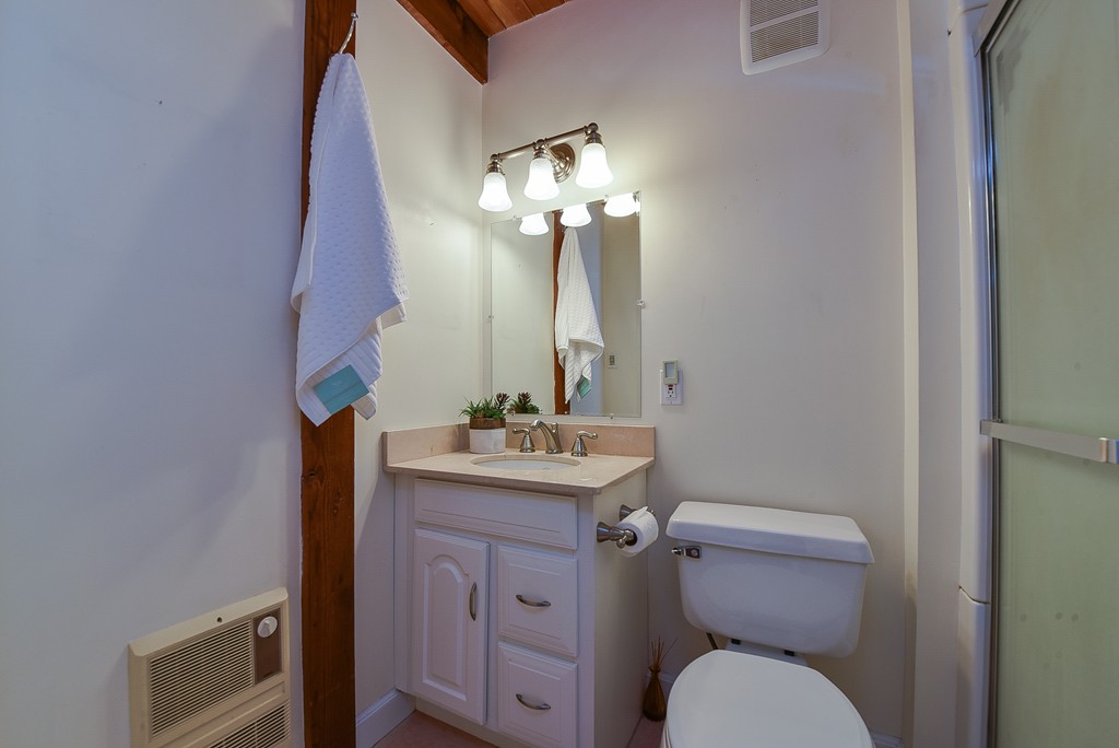65 Oakhurst Road Hopkinton, MA 01748 - Photo 8 of 27 a bathroom with a toilet a sink and mirror