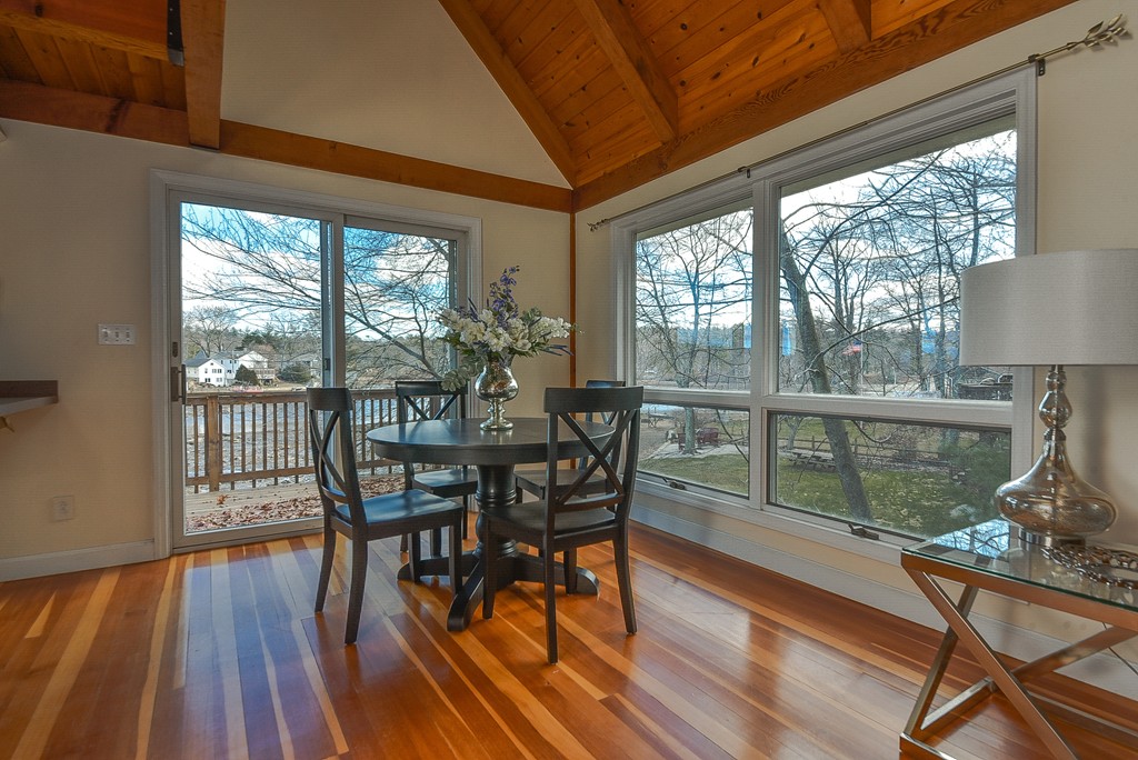 65 Oakhurst Road Hopkinton, MA 01748 - Photo 9 of 27 a view of a dining room with furniture window and wooden floor