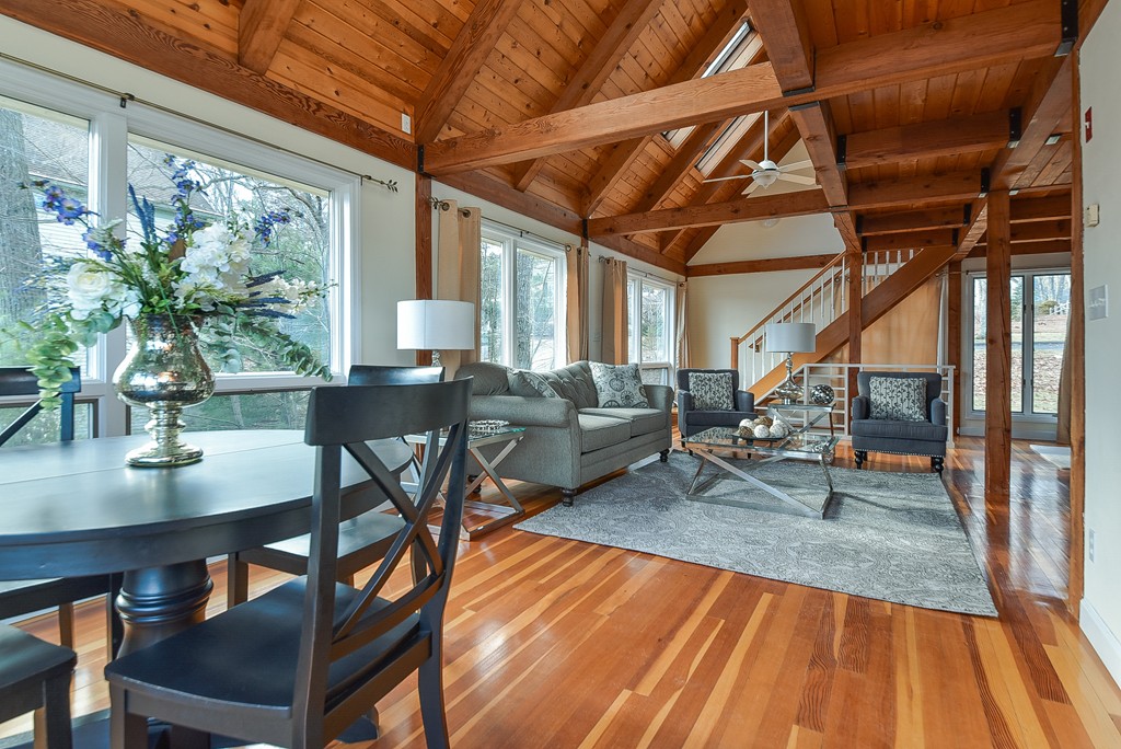 65 Oakhurst Road Hopkinton, MA 01748 - Photo 10 of 27 a view of a dining room with furniture wooden floor and a potted plant