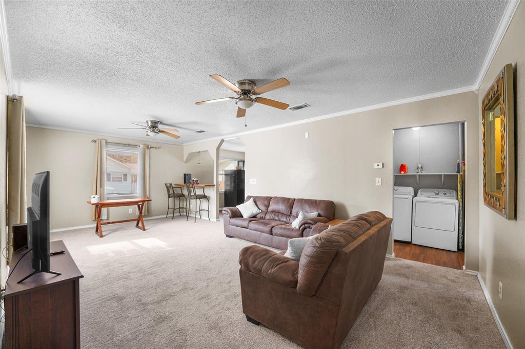 1145 Jefferson Road Paris, TX 75460 - Photo 5 of 17 a living room with furniture and a flat screen tv