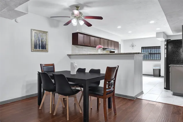 a view of closet with wooden floor