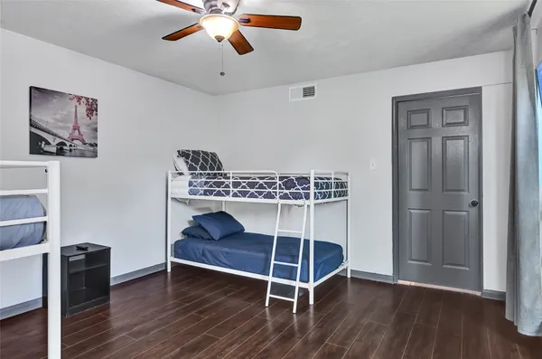 a kitchen with cabinets and white appliances