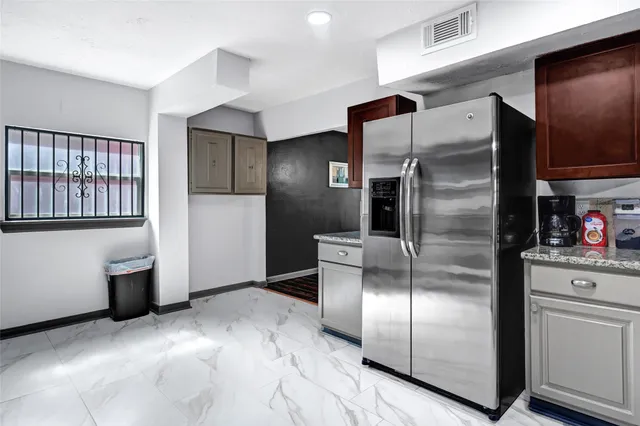 a view of hallway with wooden floor