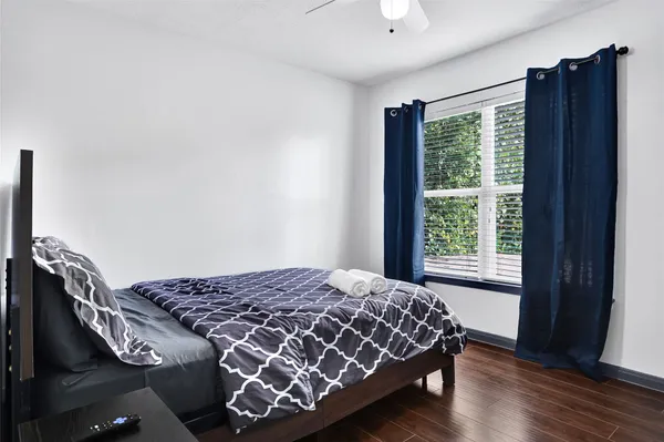 a bed sitting in a bedroom next to a small yard