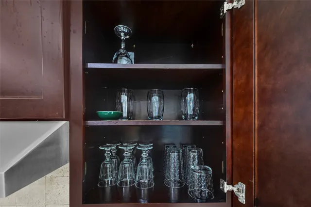 a bathroom with a toilet and a mirror