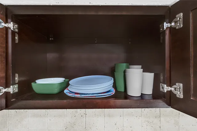 a bathroom with a toilet and a mirror