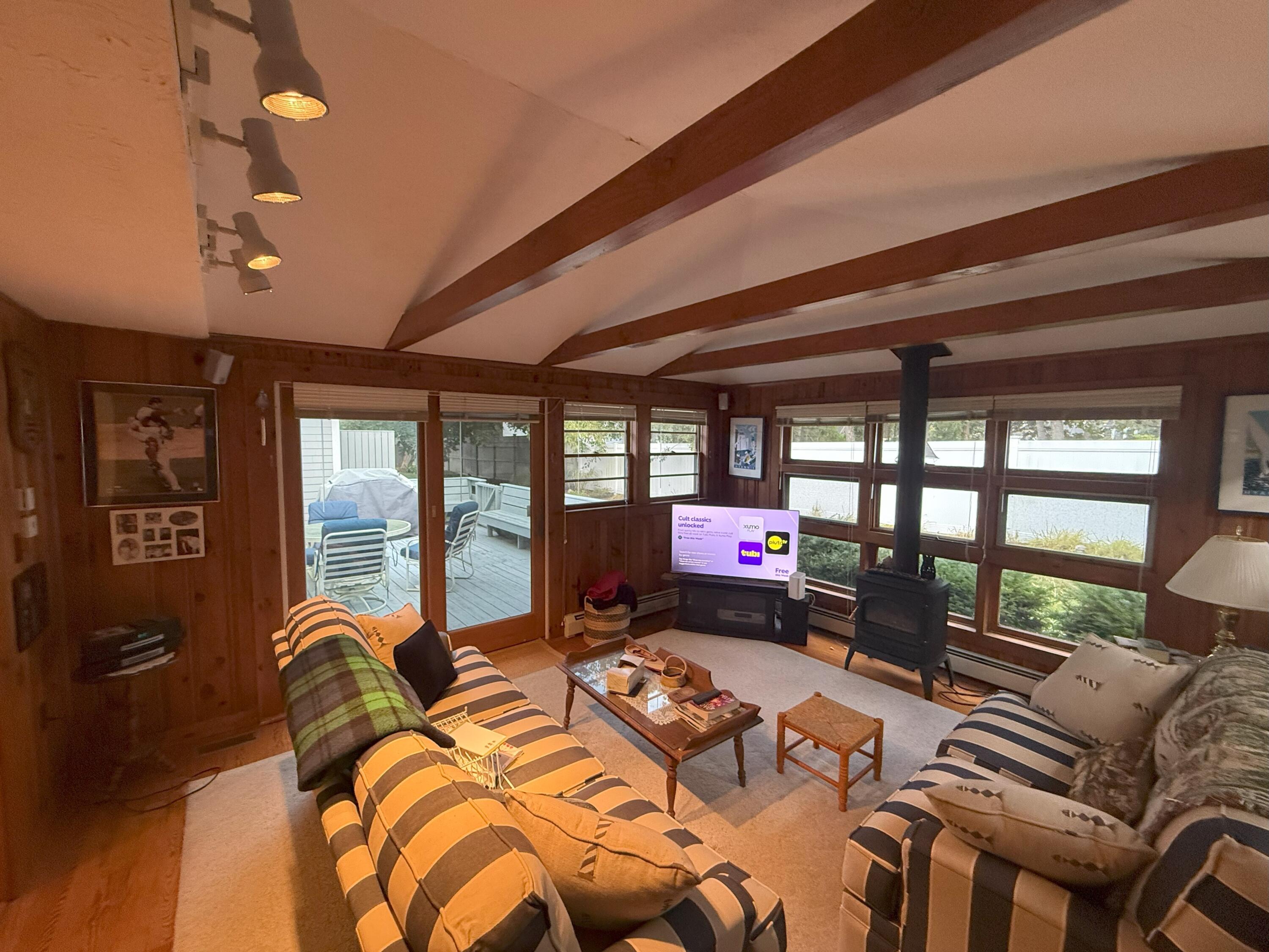 40 Studley Road Hyannis, MA 02601 - Photo 10 of 18 a bed room with furniture and a floor to ceiling window