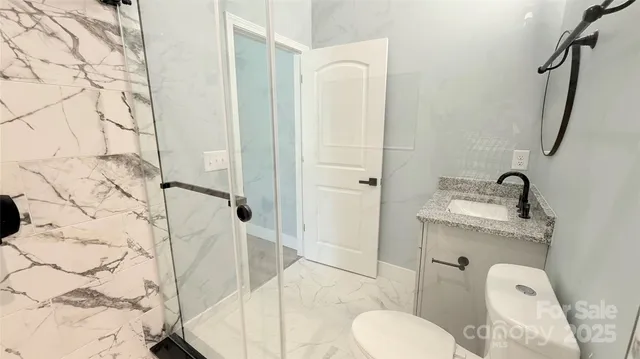 a bathroom with a sink and mirror with bathtub
