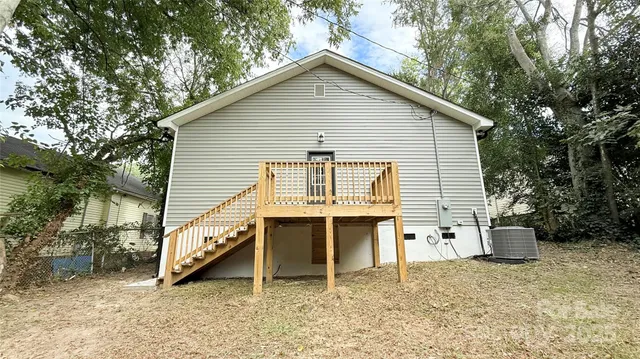 a view of a house with a yard and seating space