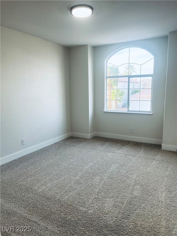 7837 Millhopper Avenue Las Vegas, NV 89128 - Photo 25 of 28 Spare room featuring carpet and baseboards