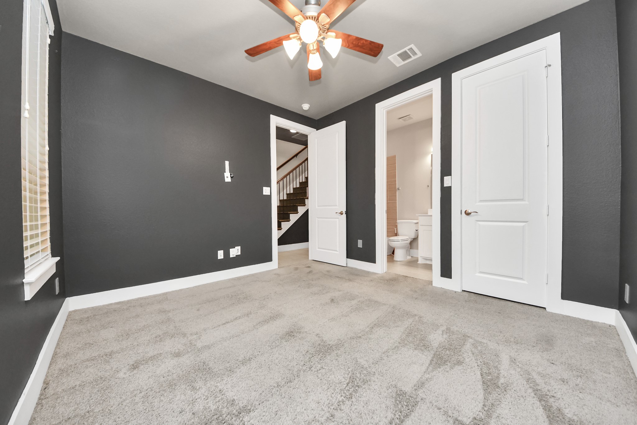 2704 Freund Street Houston, TX 77003 - Photo 6 of 45 a view of a livingroom with a ceiling fan and window
