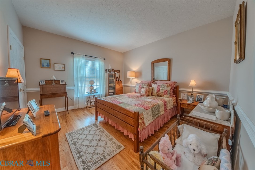 120 North Shore Road Locust Hill, VA 23092 - Photo 21 of 39 Bedroom featuring light wood-type flooring and baseboards