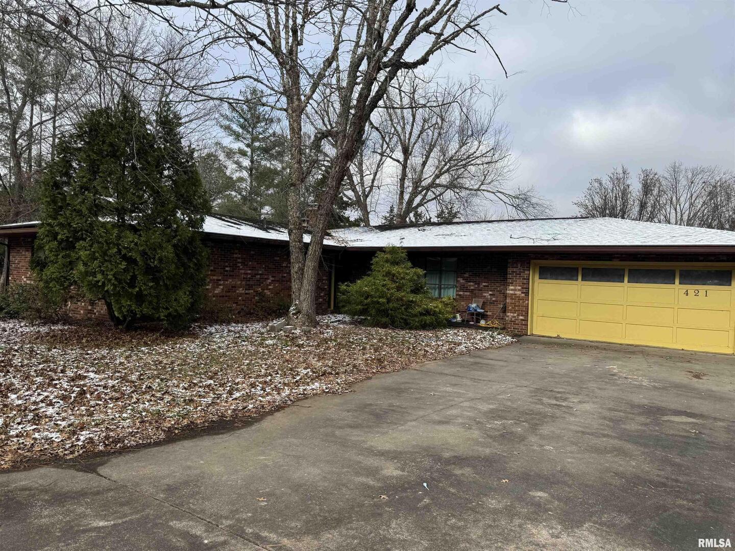421 Cook Avenue Jonesboro, IL 62952 - Photo 2 of 7 a front view of a house with a yard and a garage