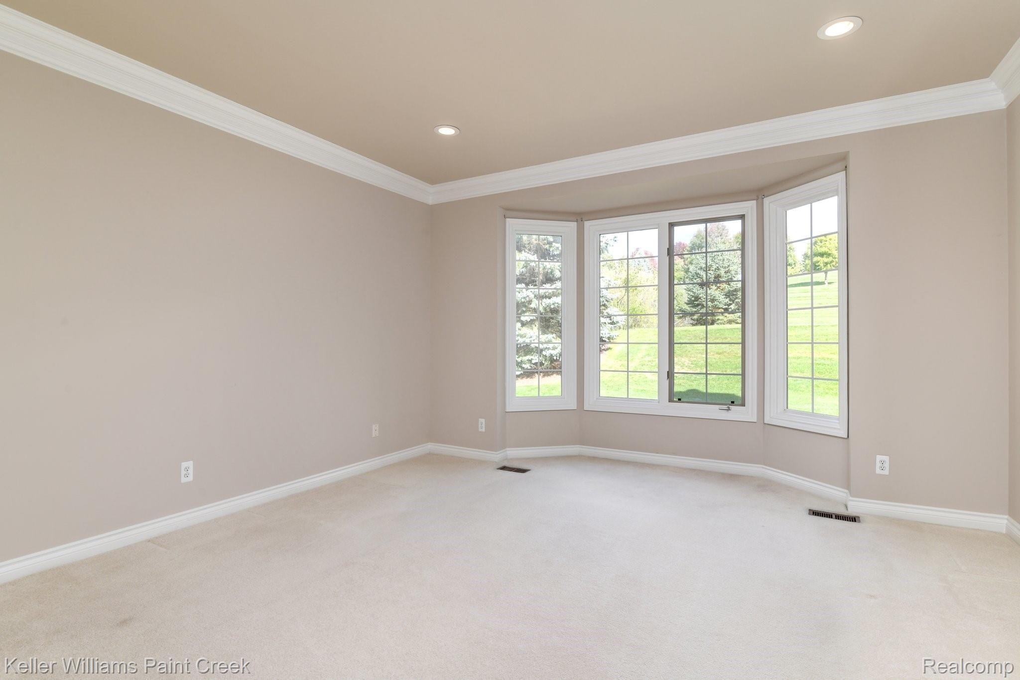 1163 Autumnview Drive Rochester, MI 48307 - Photo 4 of 34 First floor office/den with recessed lighting, crown molding and a bay window.