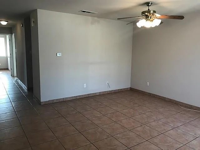 a view of a chandelier fan in a kitchen