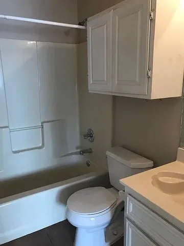 a bathroom with a toilet and a sink