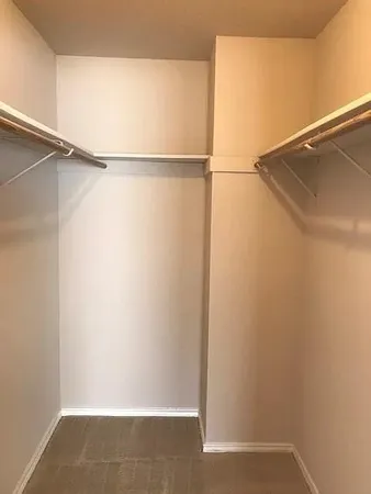 a view of an empty walk in closet