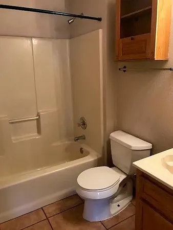 a bathroom with a toilet a sink and bathtub
