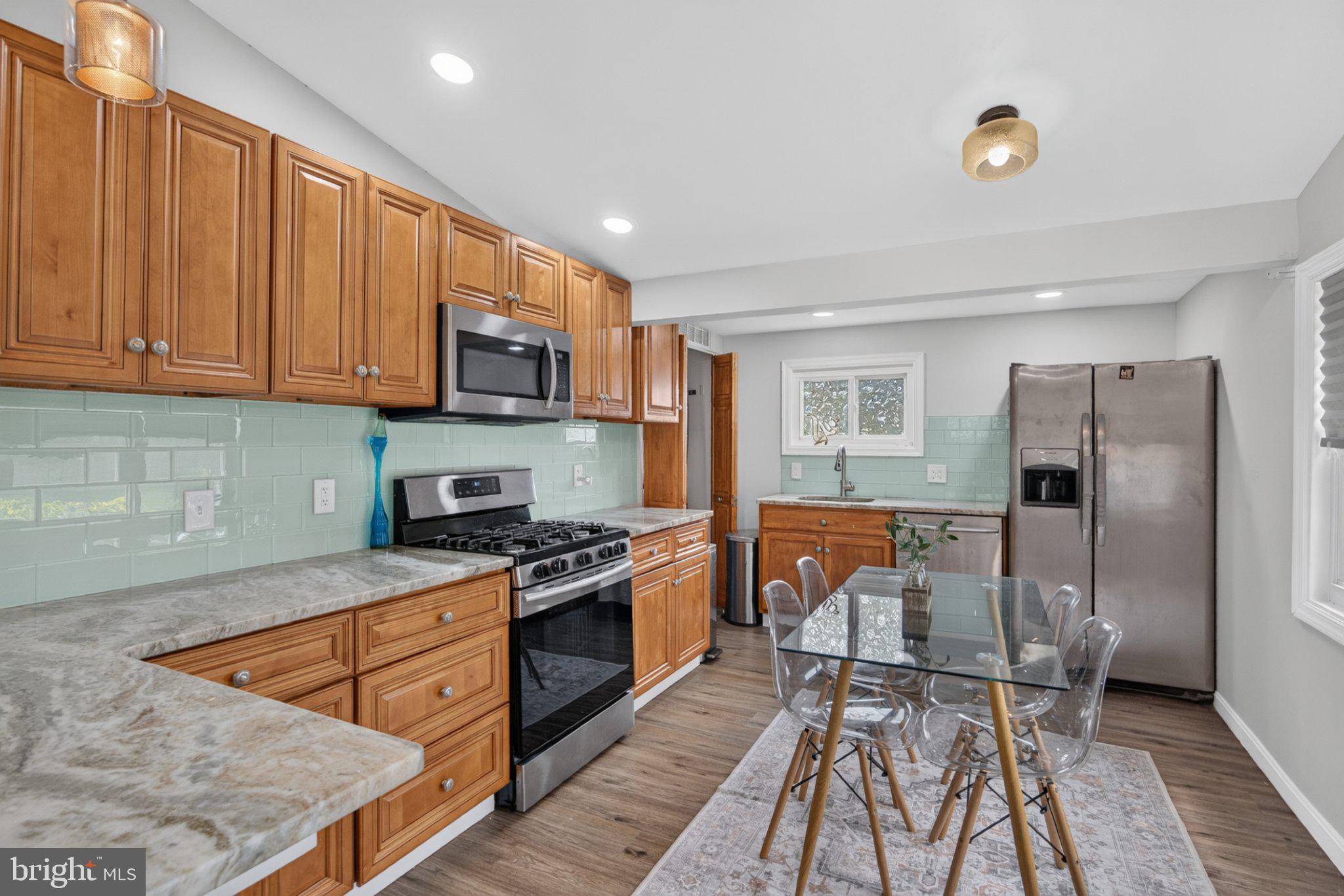 227 Ruth Avenue Maple Shade, NJ 08052 - Photo 6 of 22 Modern kitchen with warm wood tones.