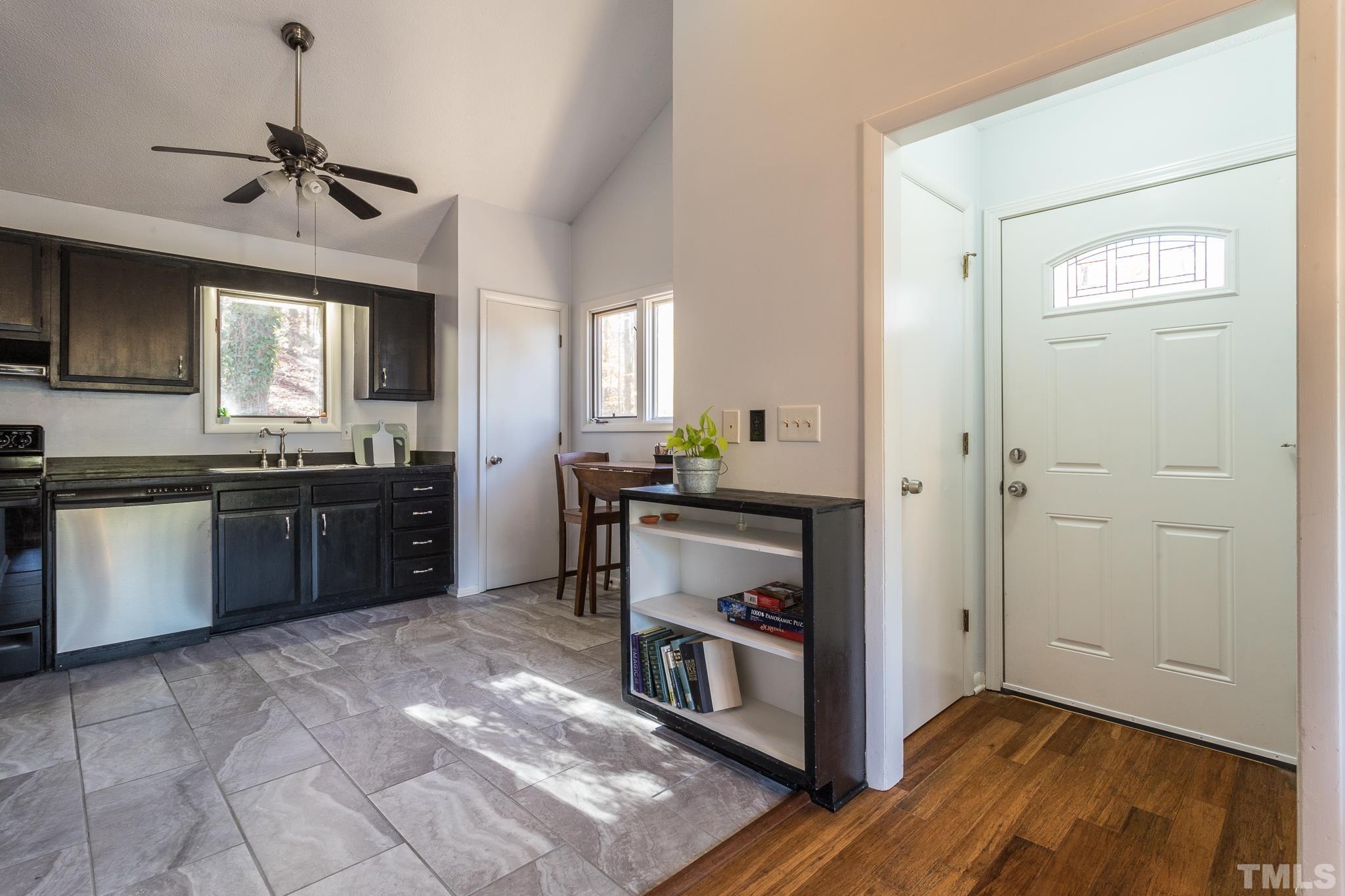 372 Cedar Lake Road Chapel Hill, NC 27516 - Photo 13 of 42 a kitchen with stainless steel appliances granite countertop a stove a sink and a refrigerator