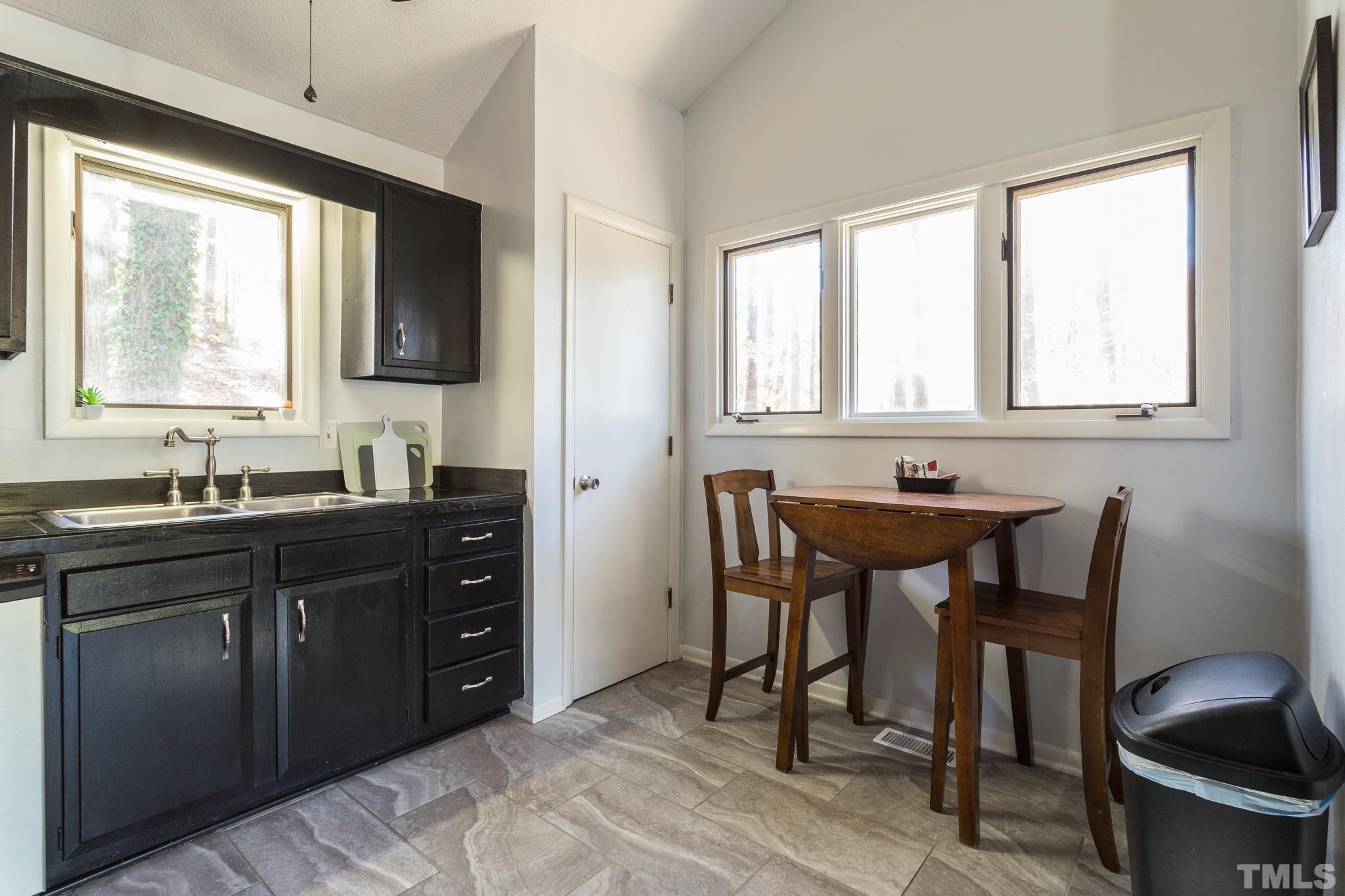 372 Cedar Lake Road Chapel Hill, NC 27516 - Photo 16 of 42 a spacious bathroom with a sink and a mirror