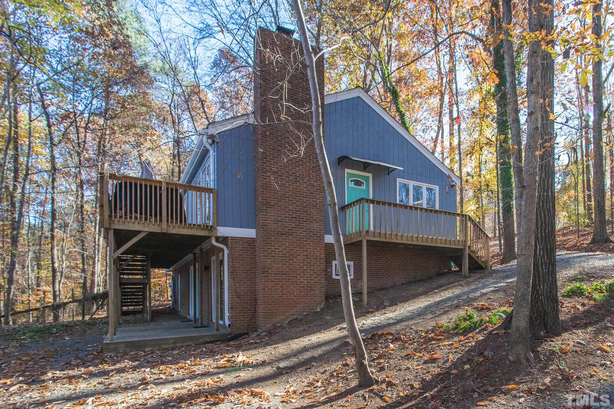 372 Cedar Lake Road Chapel Hill, NC 27516 - Photo 3 of 42 a front view of a house with parking space
