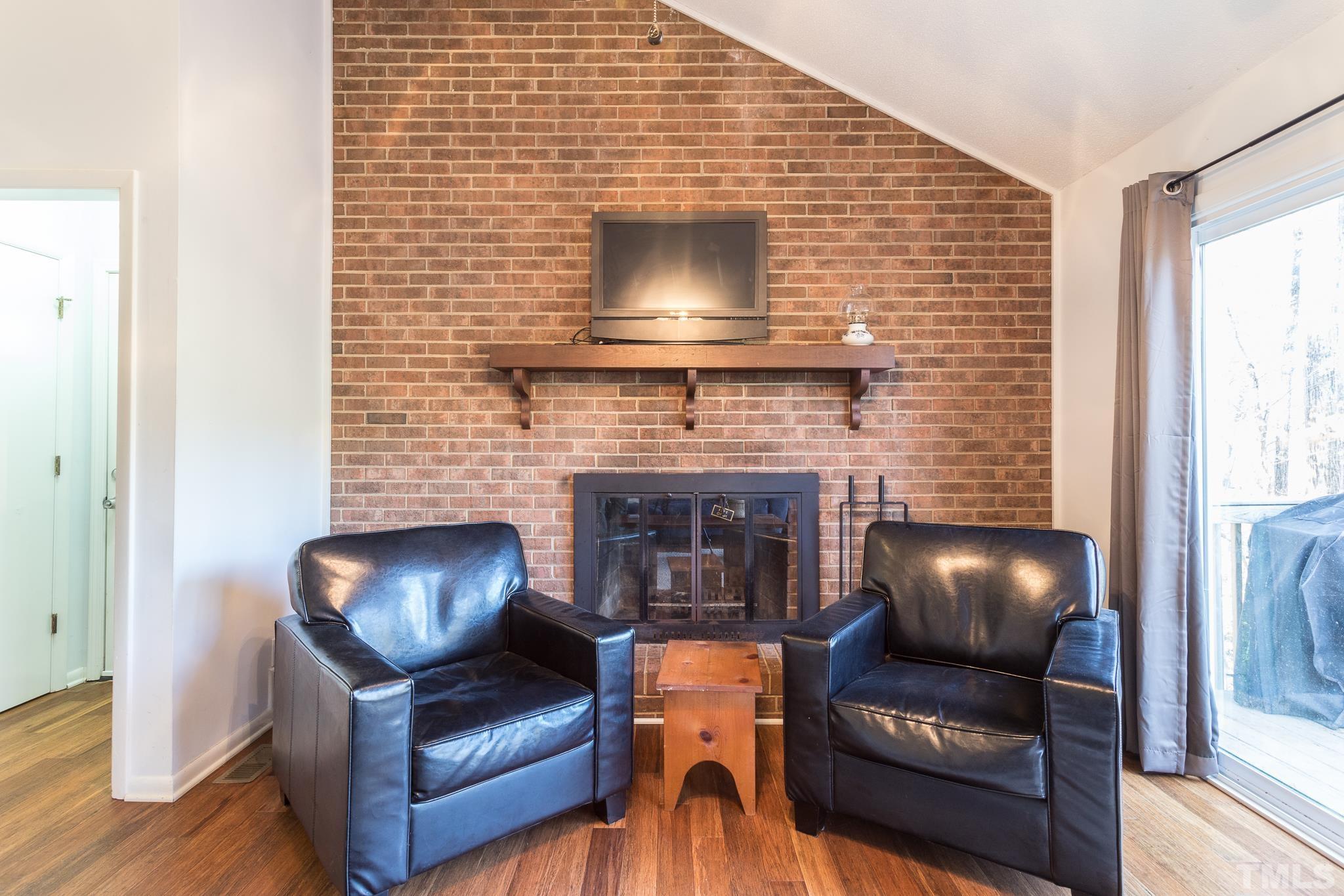 372 Cedar Lake Road Chapel Hill, NC 27516 - Photo 22 of 42 a living room with furniture and a fireplace