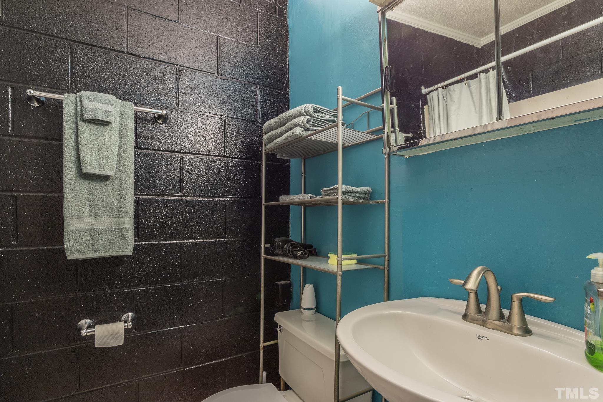 372 Cedar Lake Road Chapel Hill, NC 27516 - Photo 41 of 42 a bathroom with a sink toilet and shower