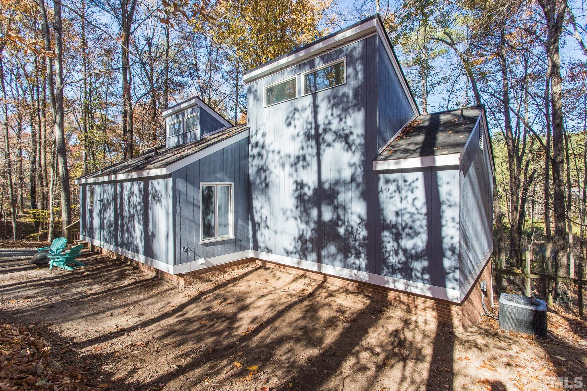 372 Cedar Lake Road Chapel Hill, NC 27516 - Photo 9 of 42 a front view of a house with wooden fence