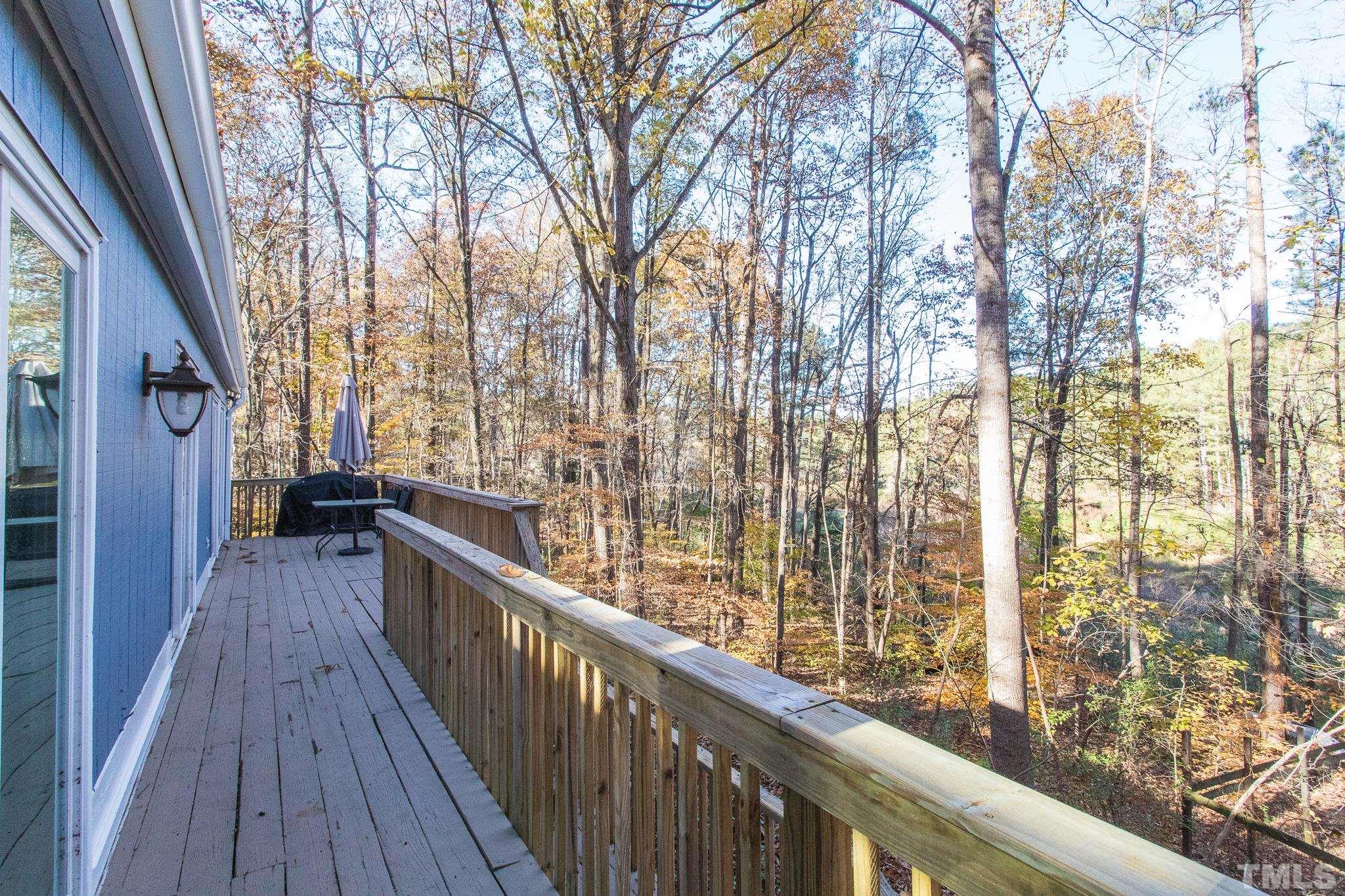 372 Cedar Lake Road Chapel Hill, NC 27516 - Photo 10 of 42 a view of balcony with wooden floor and fence