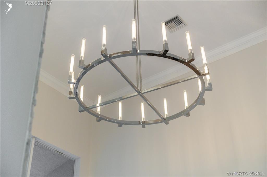 2561 Eventide Place Stuart, FL 34994 - Photo 54 of 65 a view of a livingroom with a ceiling fan and entryway