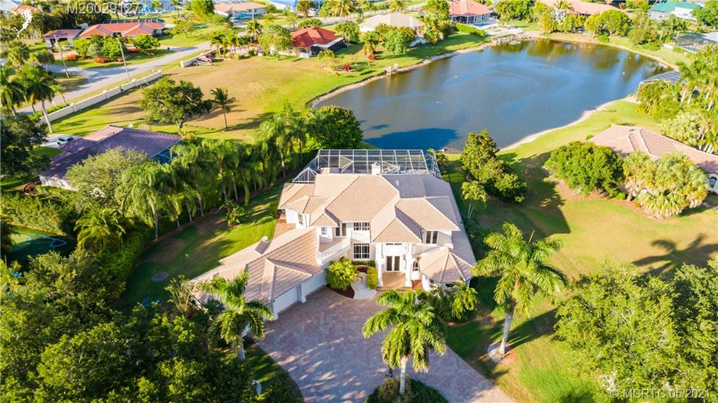2561 Eventide Place Stuart, FL 34994 - Photo 10 of 65 an aerial view of a house with swimming pool and garden